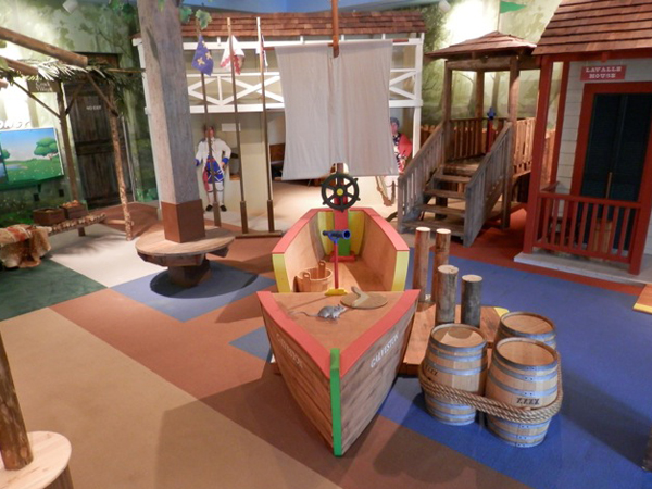 Custom sheet vinyl indoor play ground flooring that is shipped themed complete with a boat to play in and a sail. This sheet vinyl flooring is antimicrobial and is safe playground flooring.